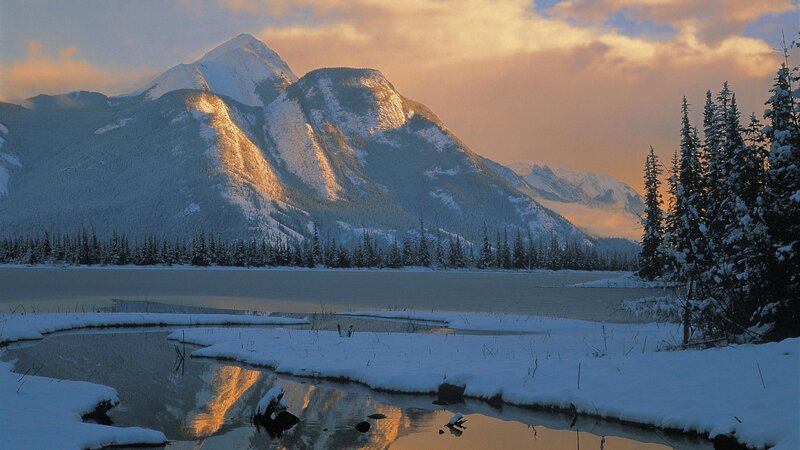 Snowy mountains at sunset