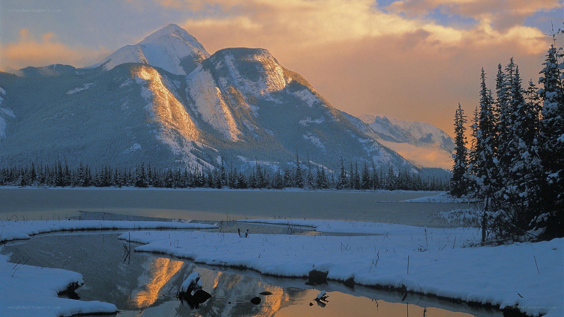 Snowy mountains at sunset
