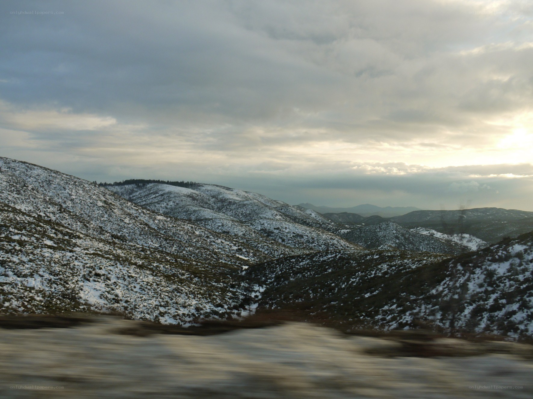 snowy mountains at sunset