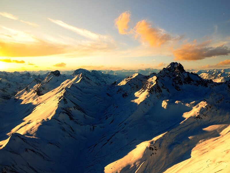 Snowy mountains at sunset