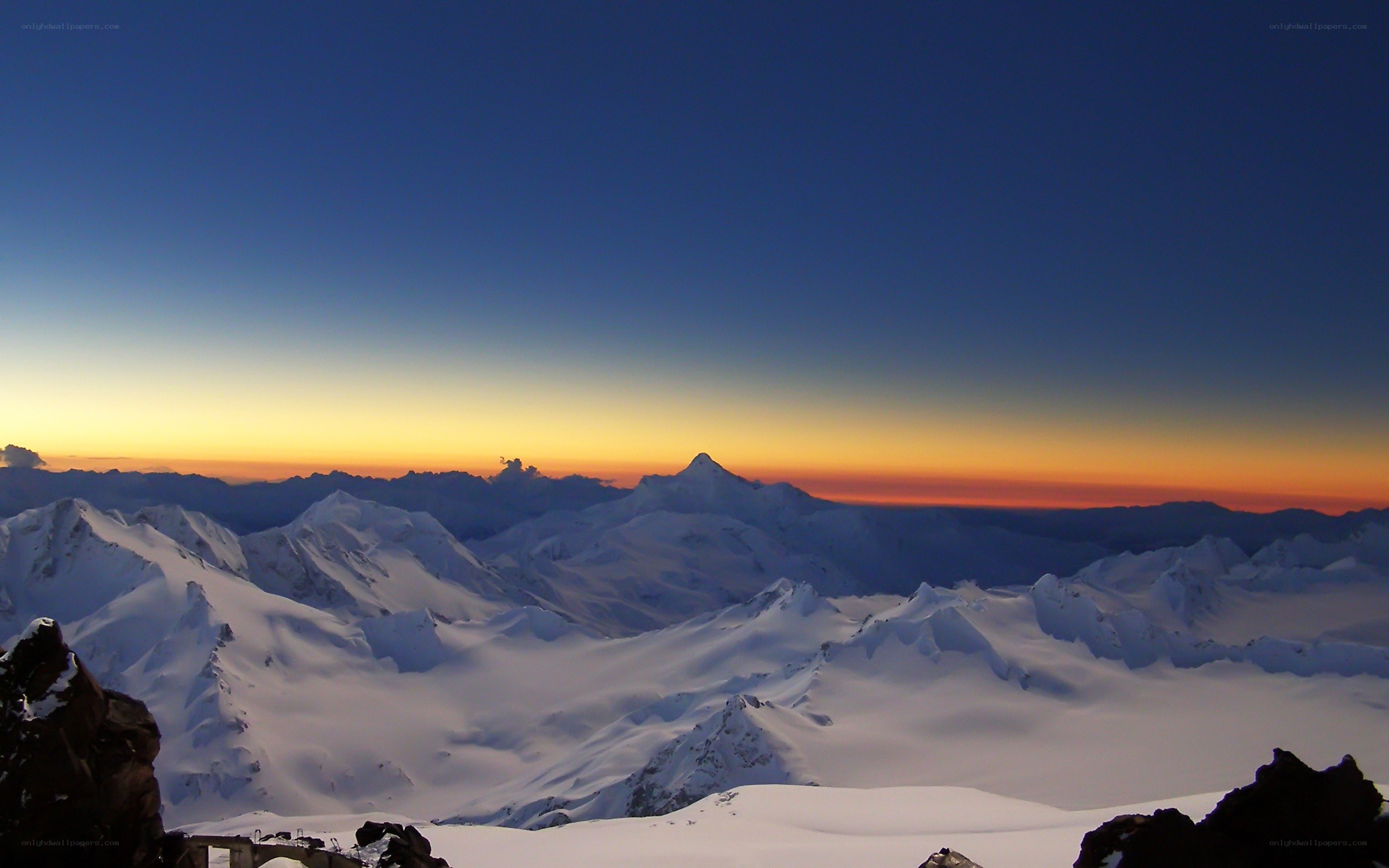 snowy mountains at sunset