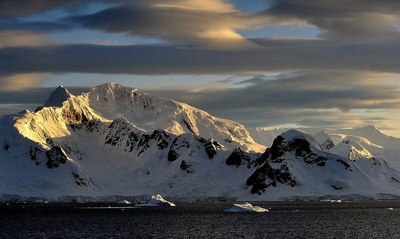 Snowy mountains at sunset