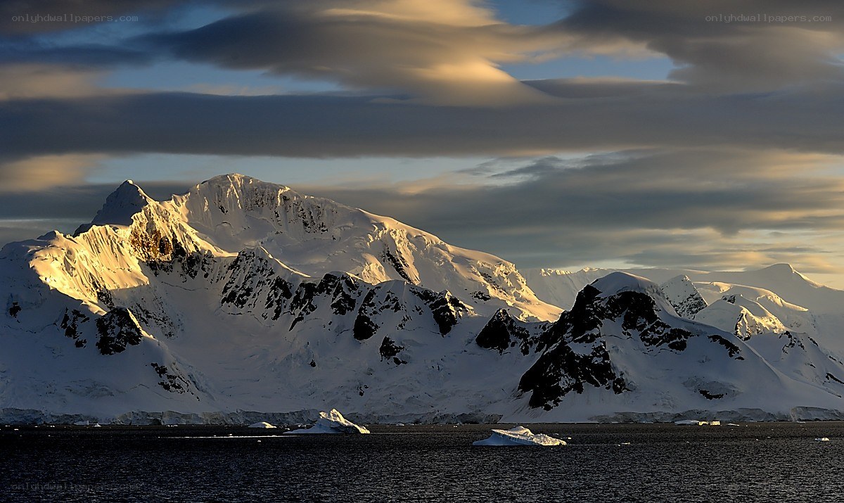 Snowy mountains at sunset