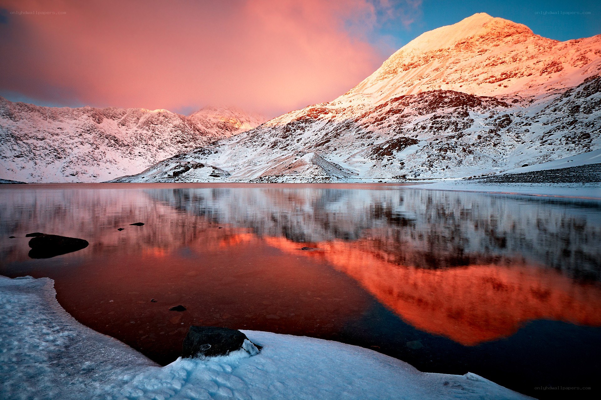Snowy mountains at sunset