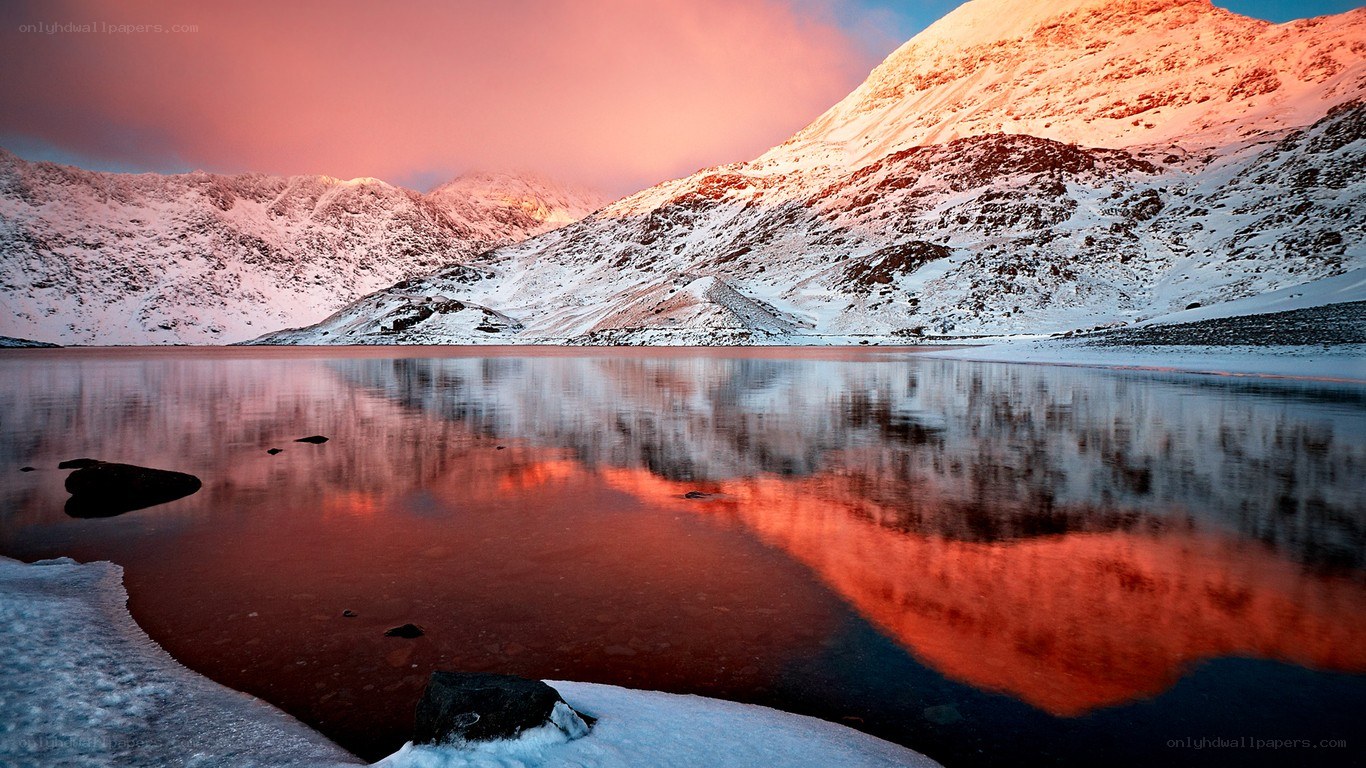 Snowy mountains at sunset