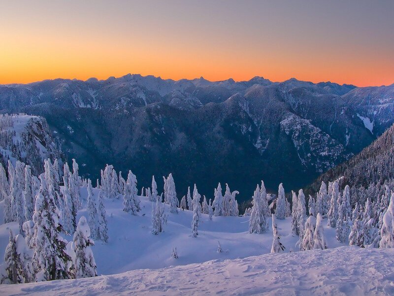 Snowy mountains at sunset