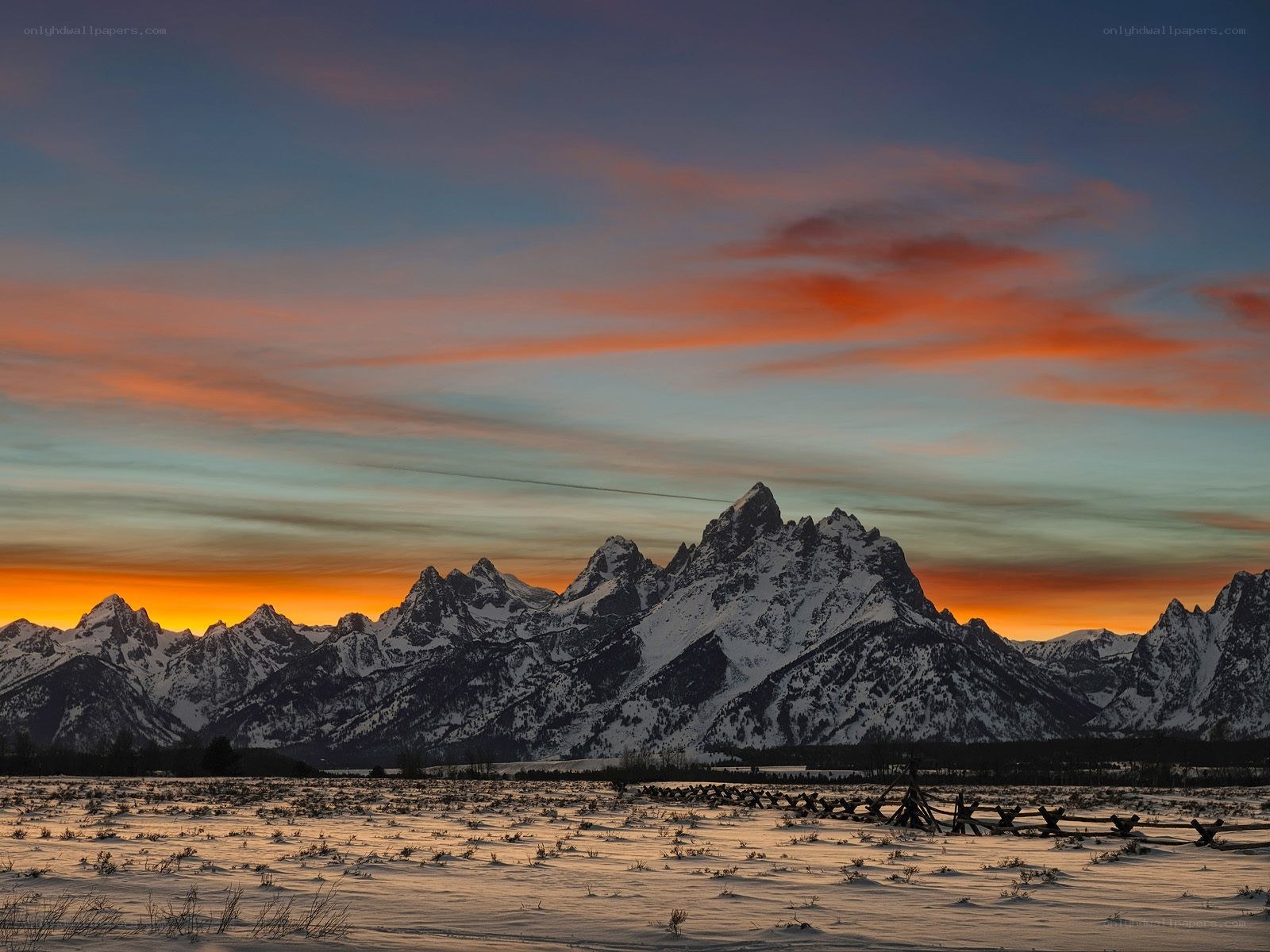 Snowy mountains at sunset