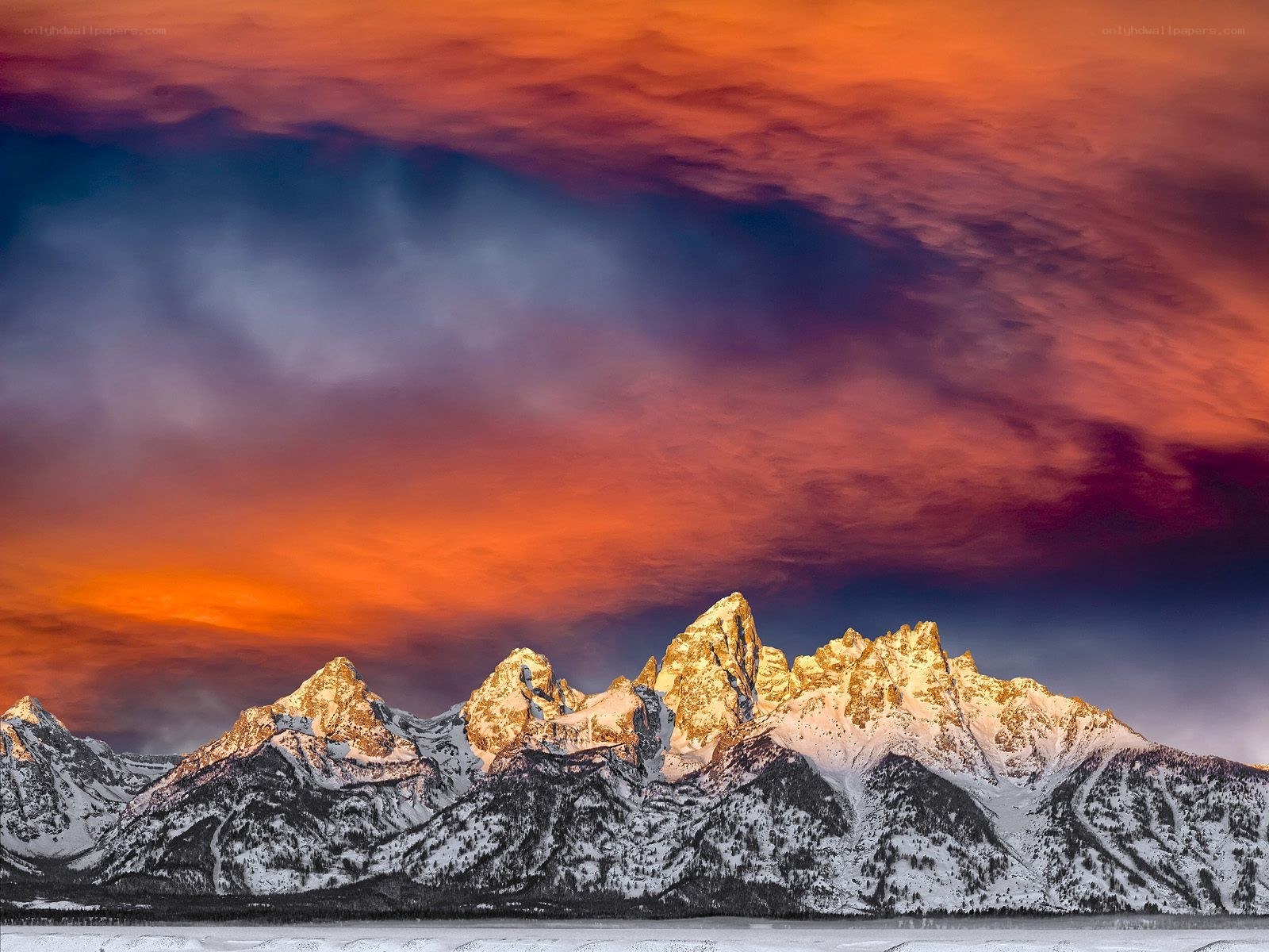 Snowy mountains at sunset