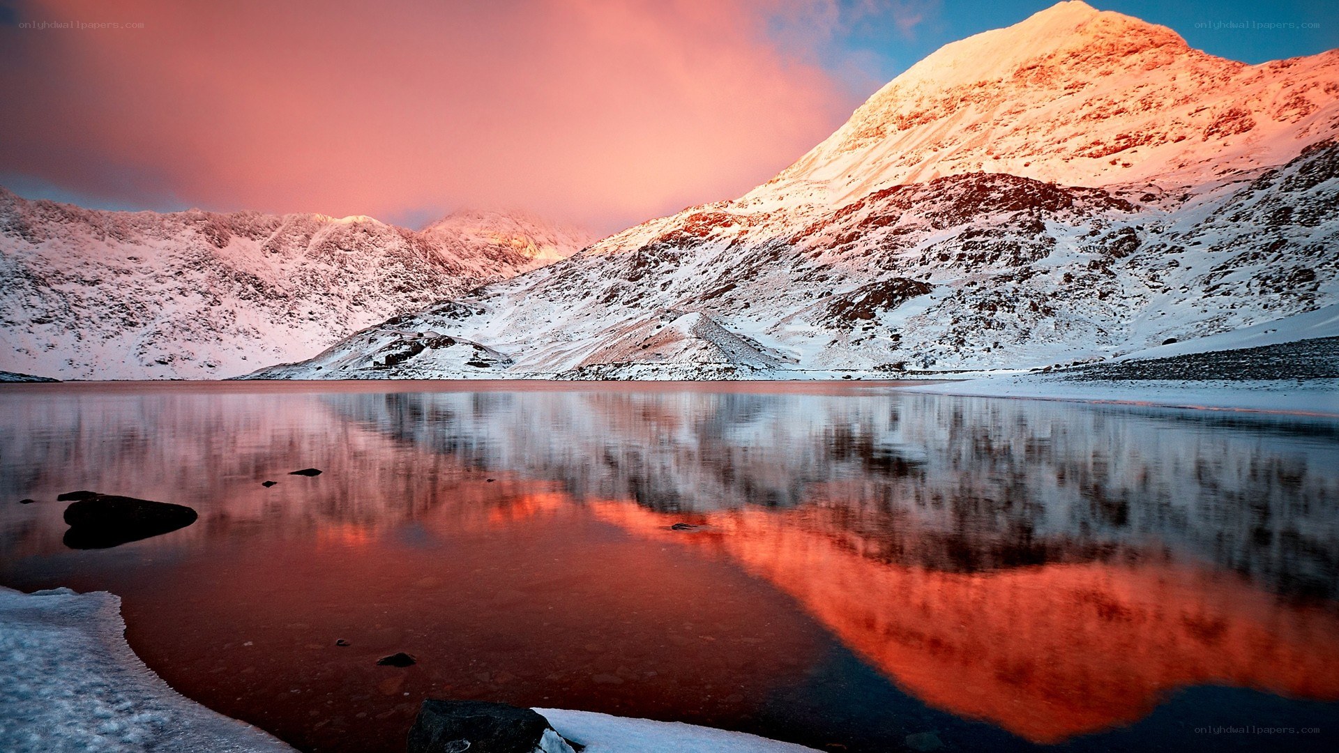 Snowy mountains at sunset