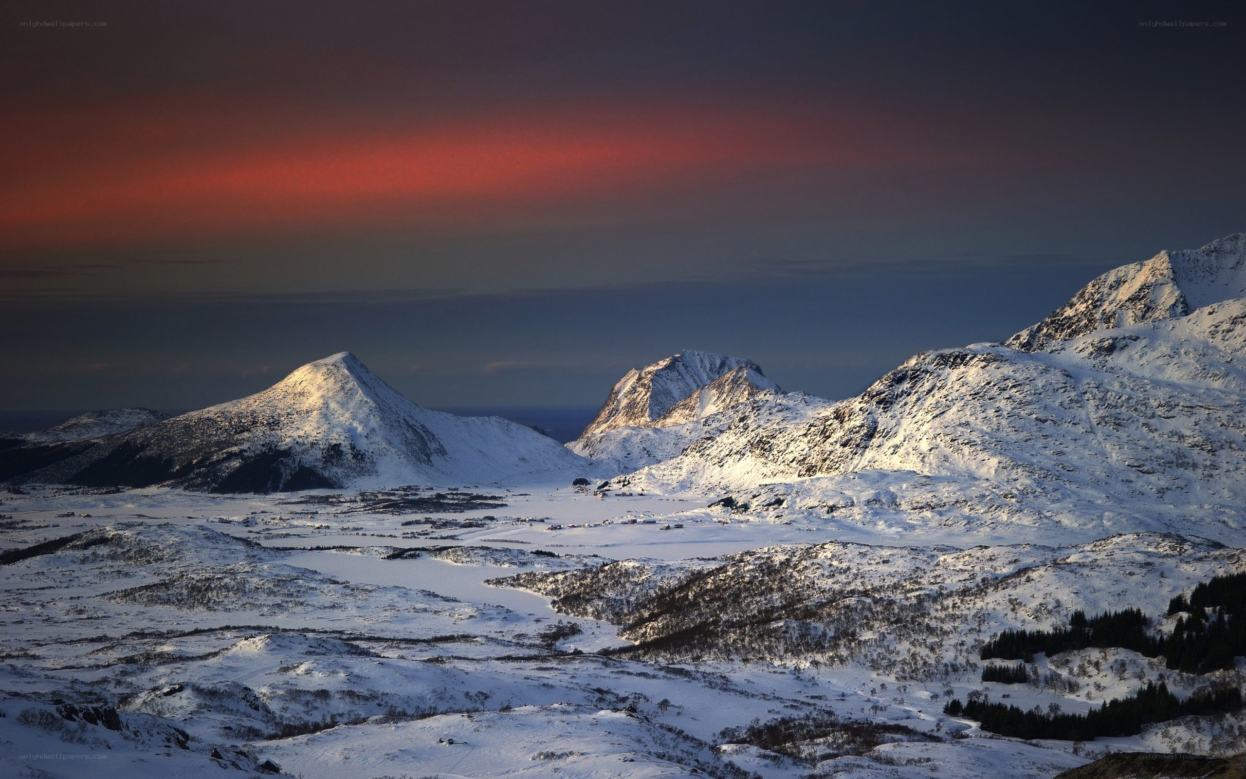 snowy mountains at sunset