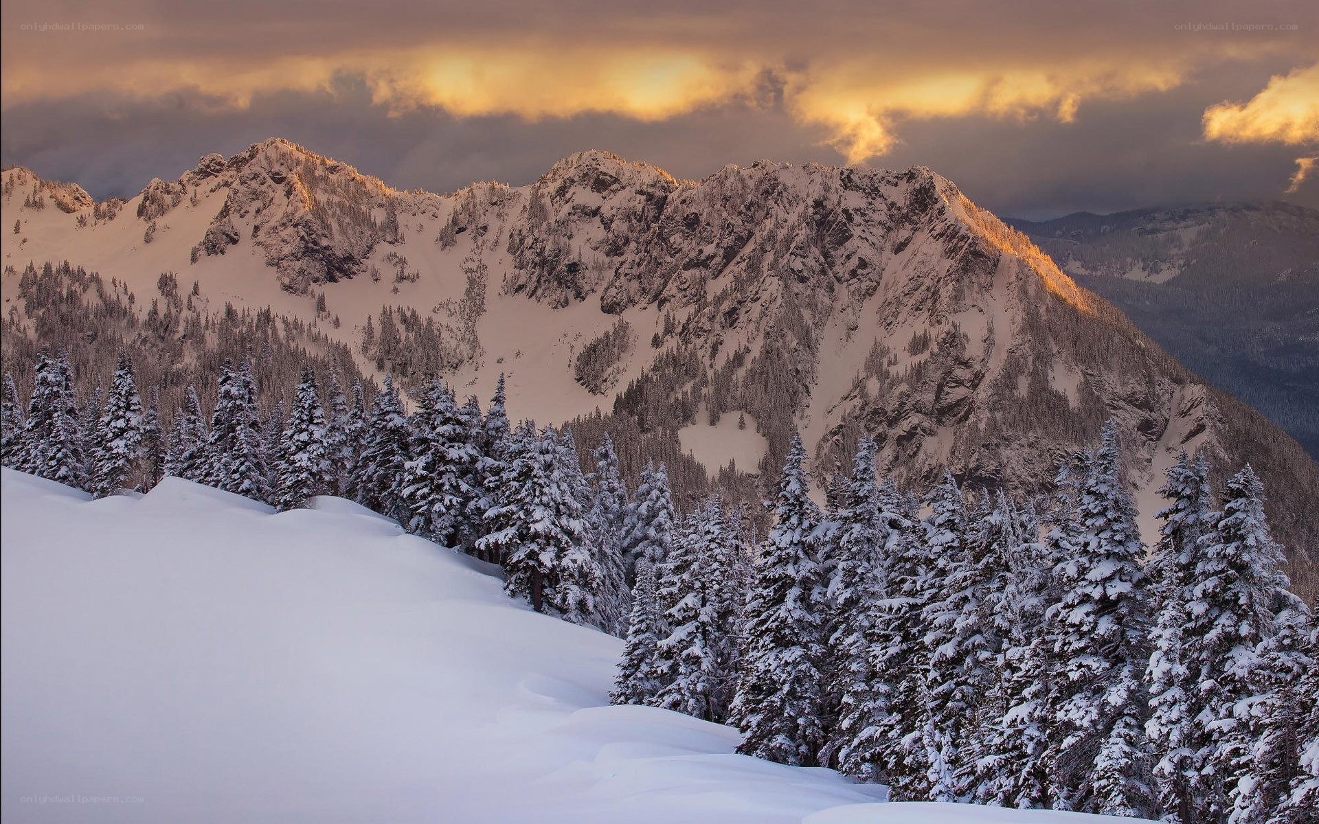 Snowy mountains at sunset
