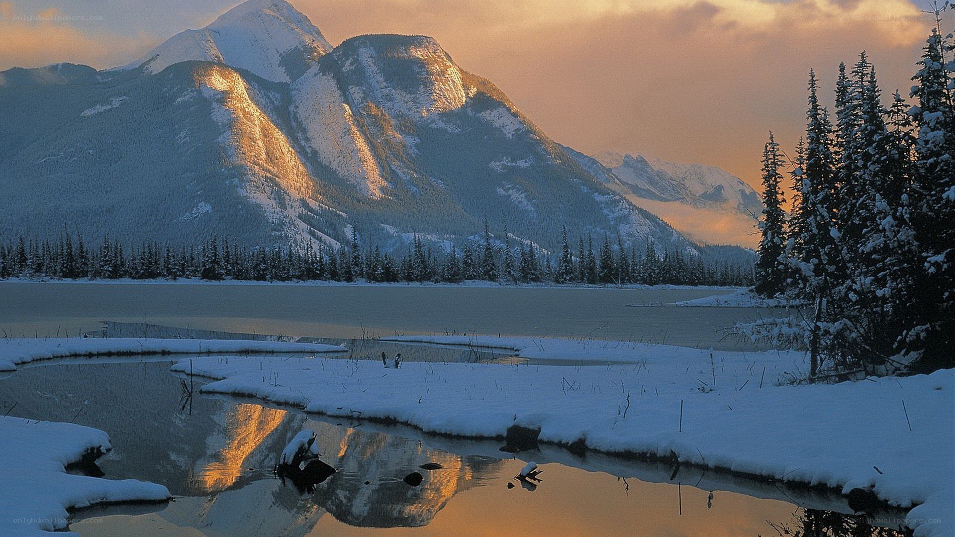 Snowy mountains at sunset