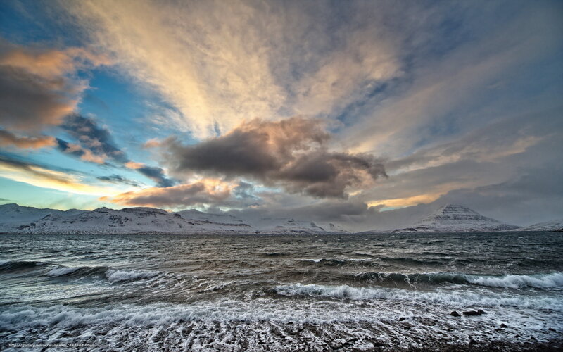 Snowy mountains by the sea