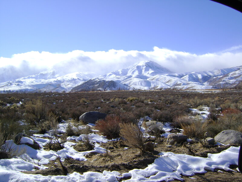snowy mountains in a desert landscape
