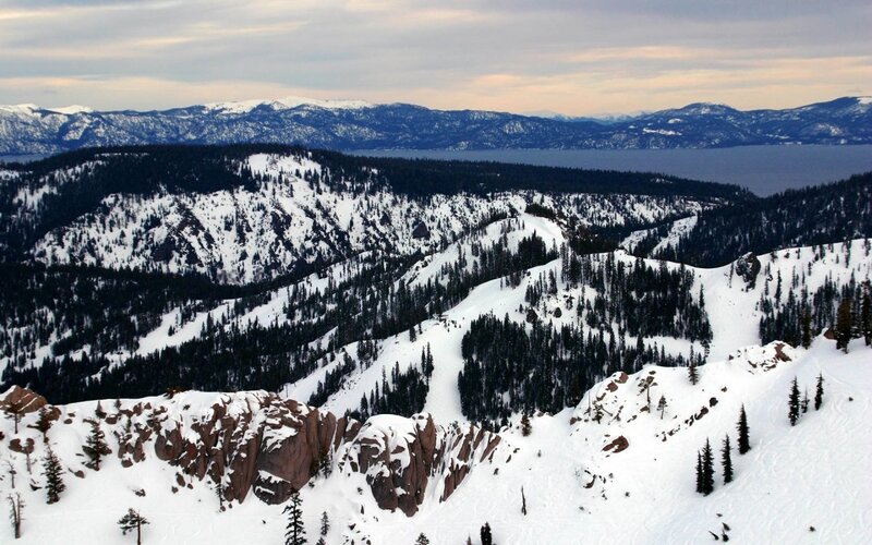 snowy mountains overlooking a lake