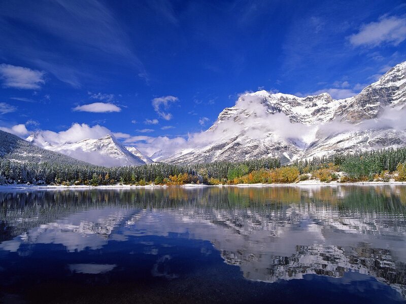 Snowy mountains reflected in a lake