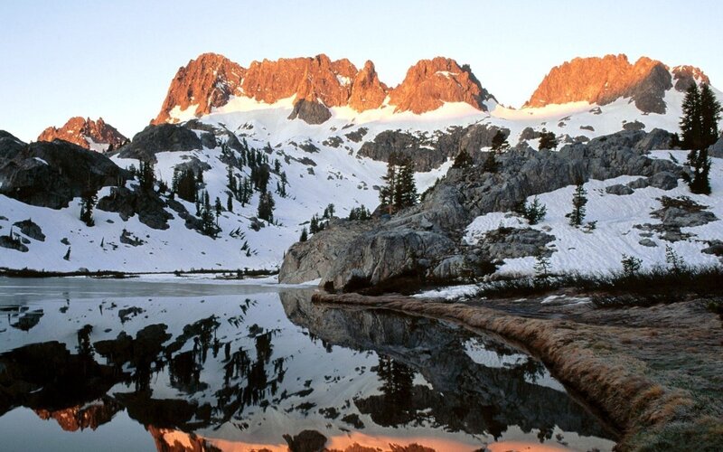 Snowy mountains reflected in a lake