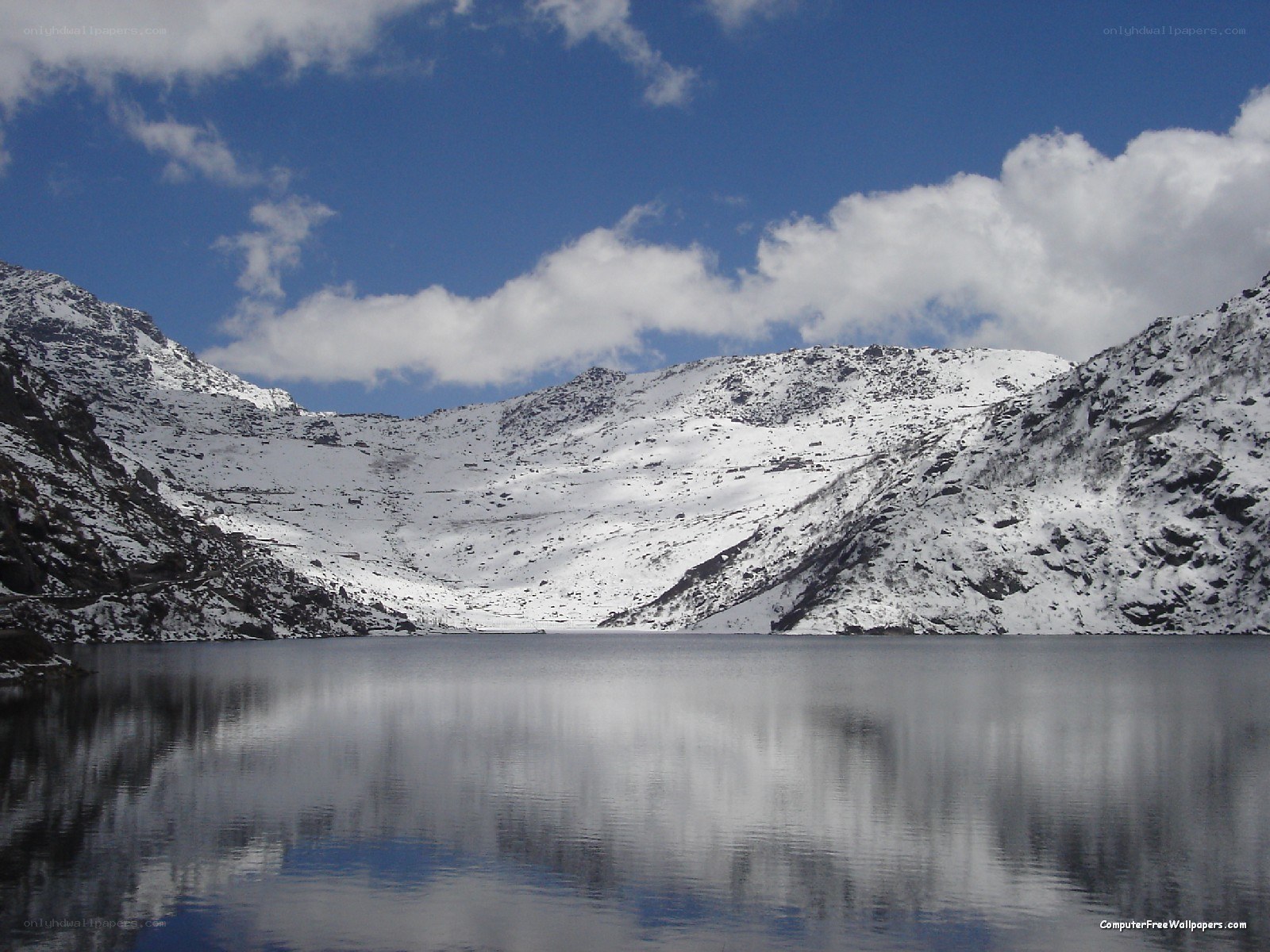 snowy mountains reflected in a lake