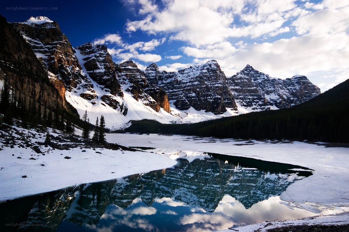 Snowy mountains reflected in a lake