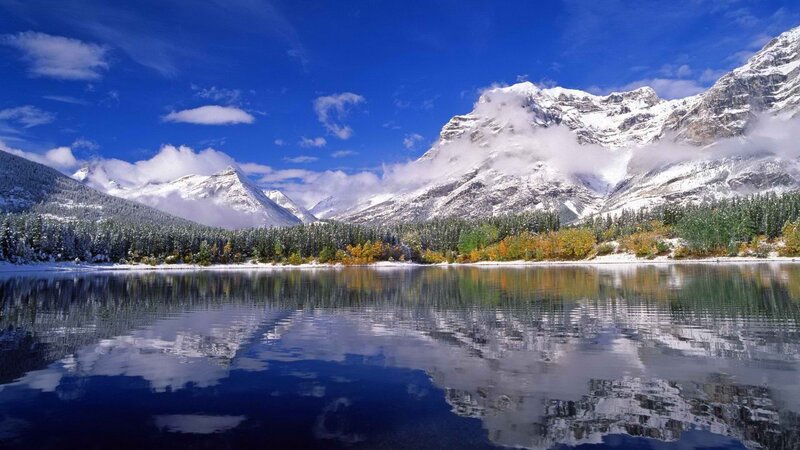 Snowy mountains reflected in a lake