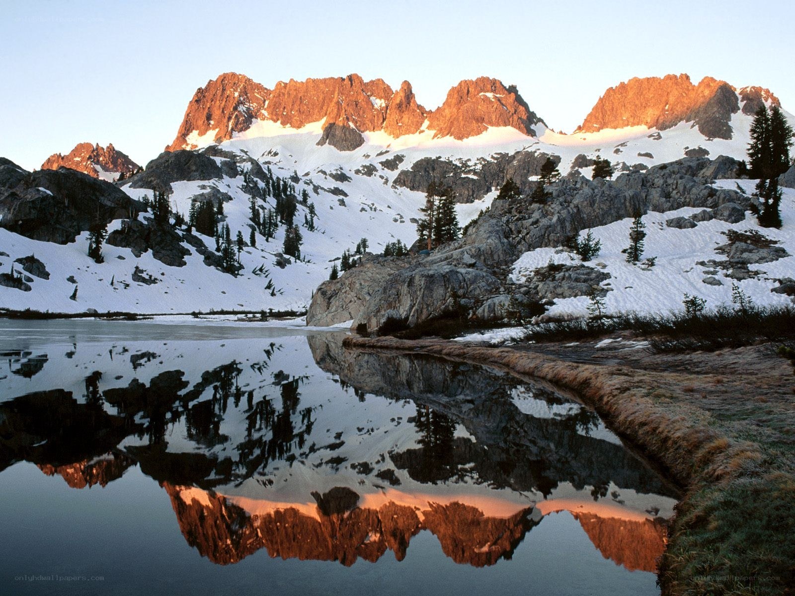 Snowy mountains reflected in a lake