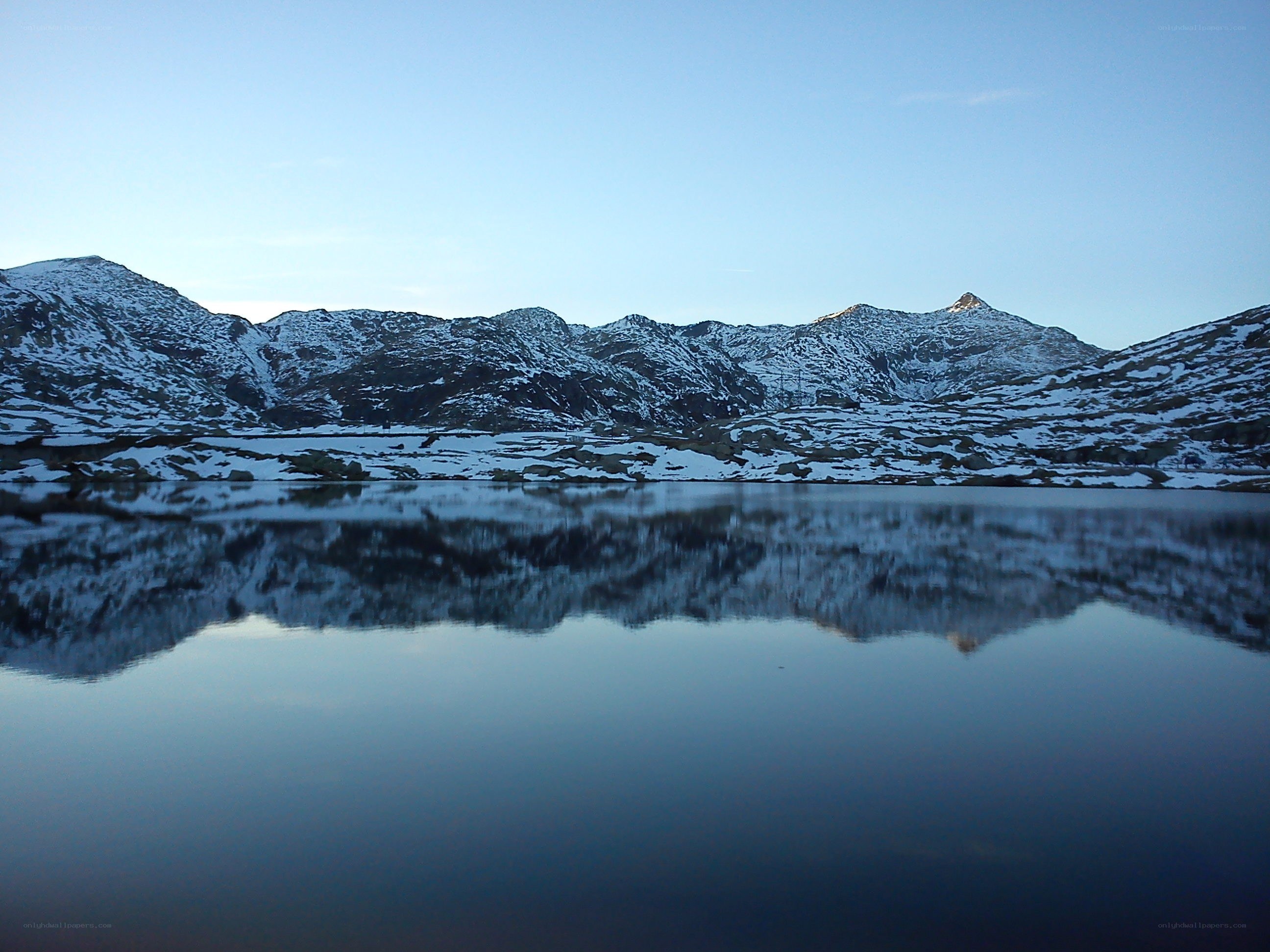 Snowy mountains reflected in a lake