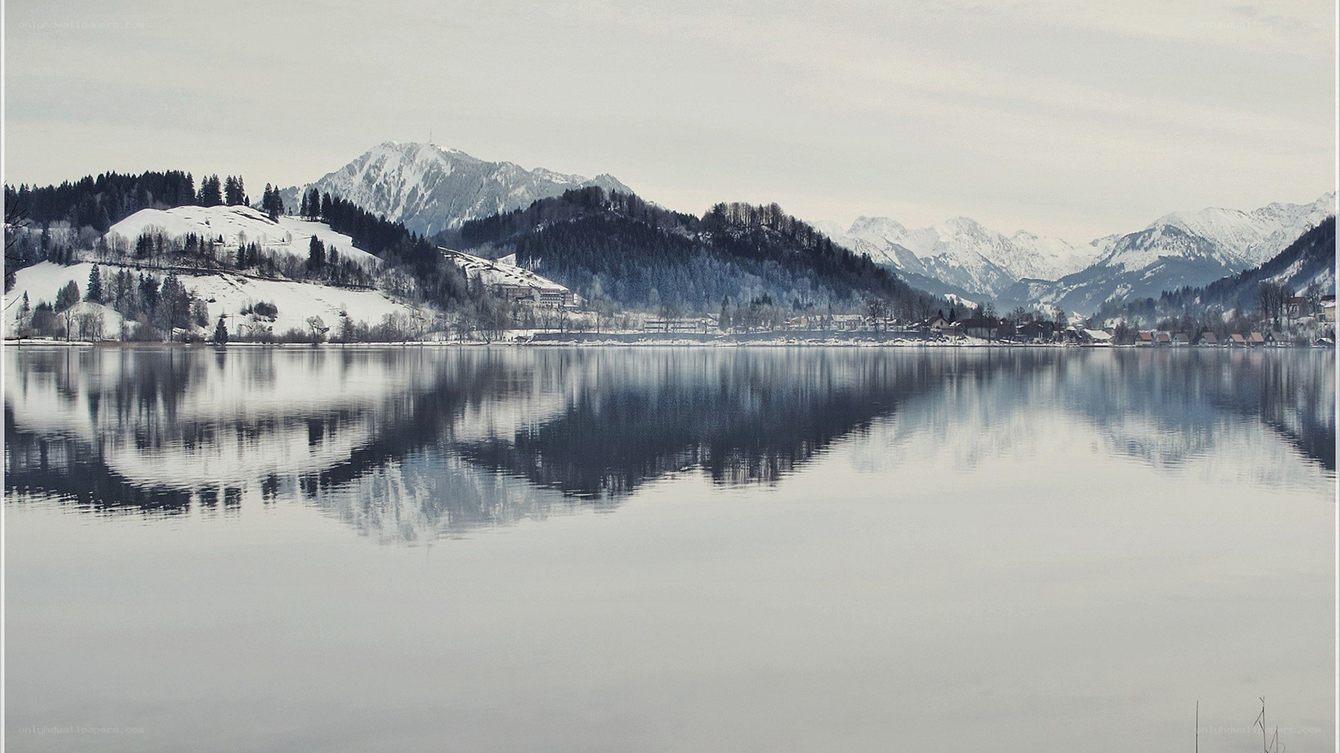 Snowy mountains reflected in a lake