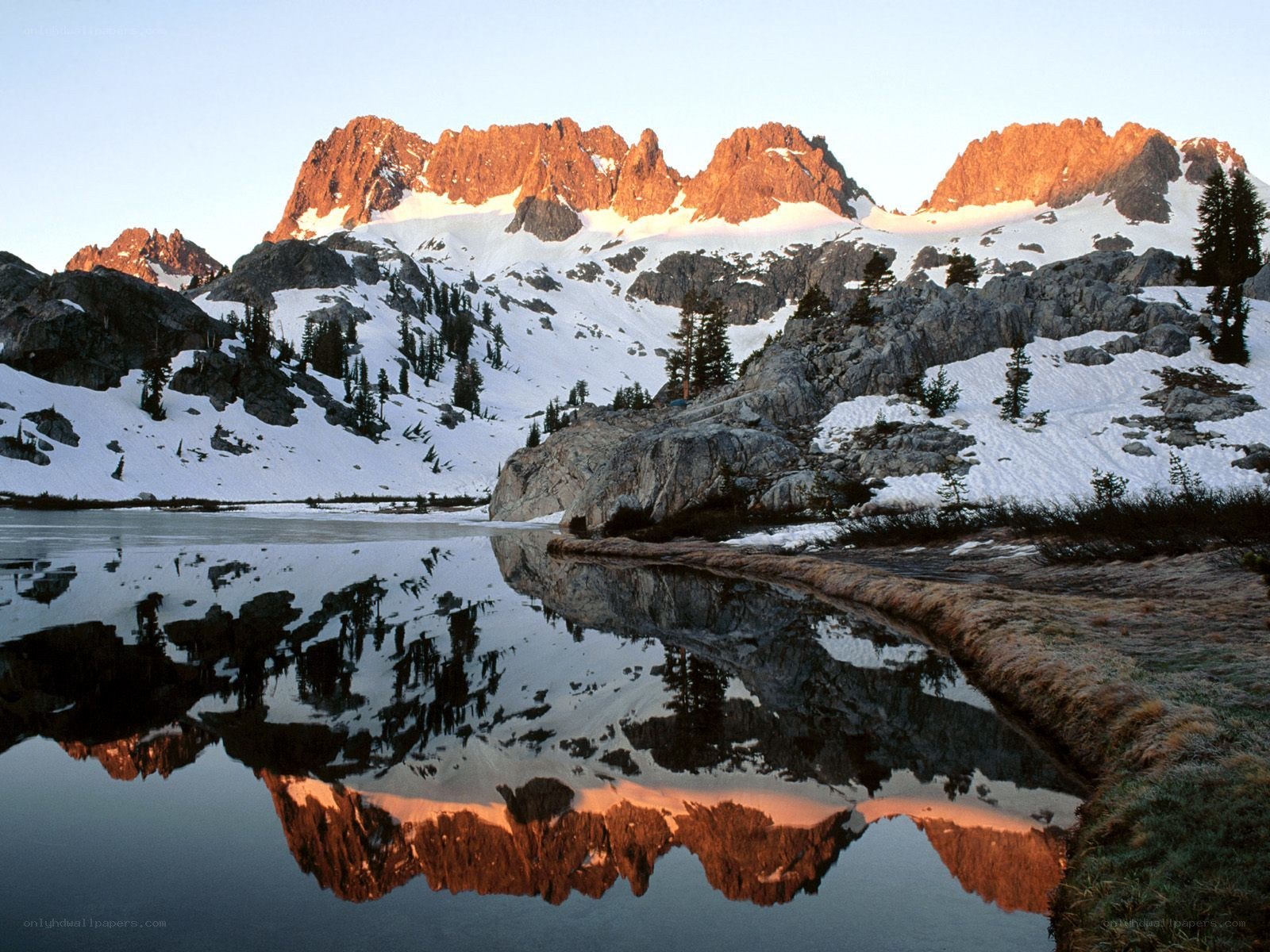 Snowy mountains reflected in a lake