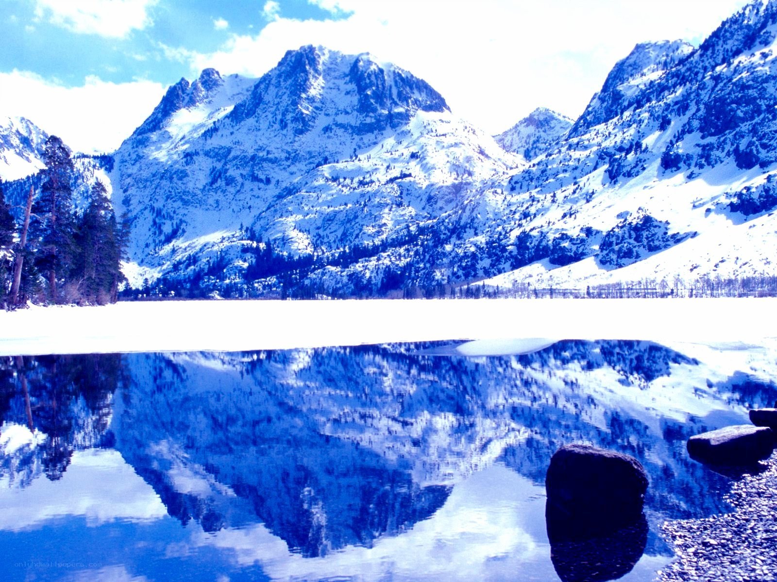 Snowy mountains reflected in a lake