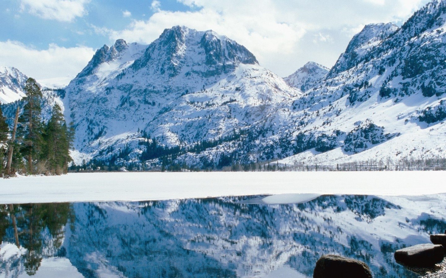 Snowy mountains reflected in a lake
