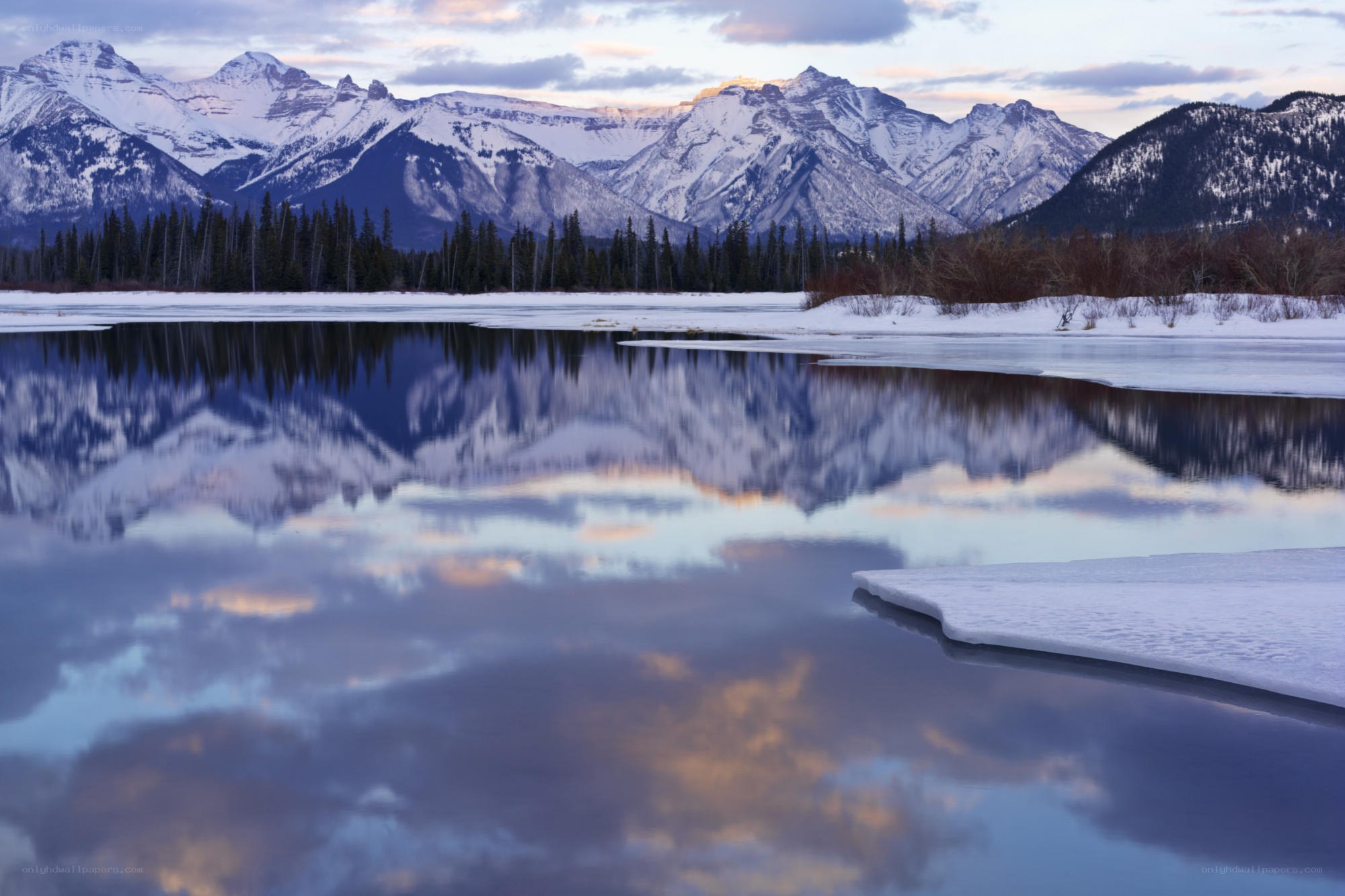 Snowy mountains reflected in a lake