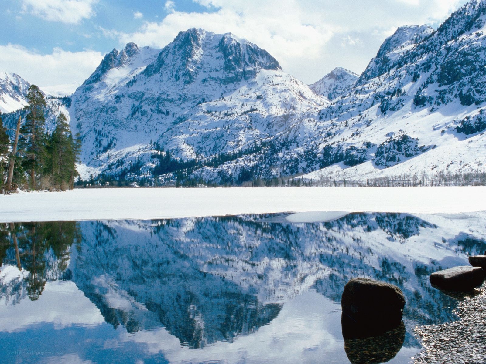Snowy mountains reflected in a lake