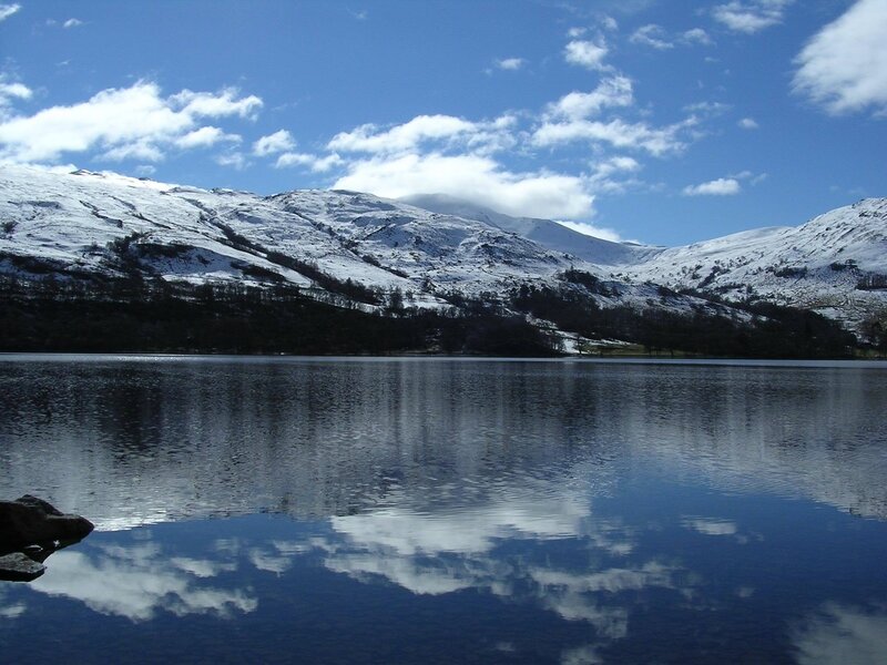 Snowy mountains reflected in a lake