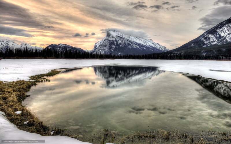 Snowy mountains reflected in a lake