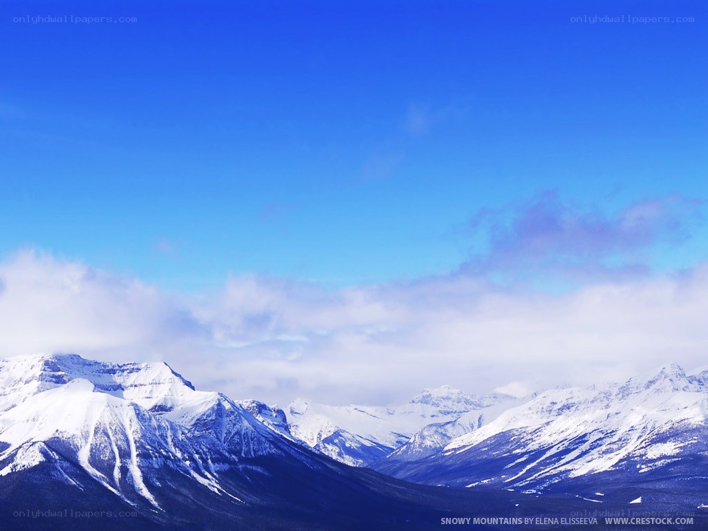 Snowy mountains under blue sky