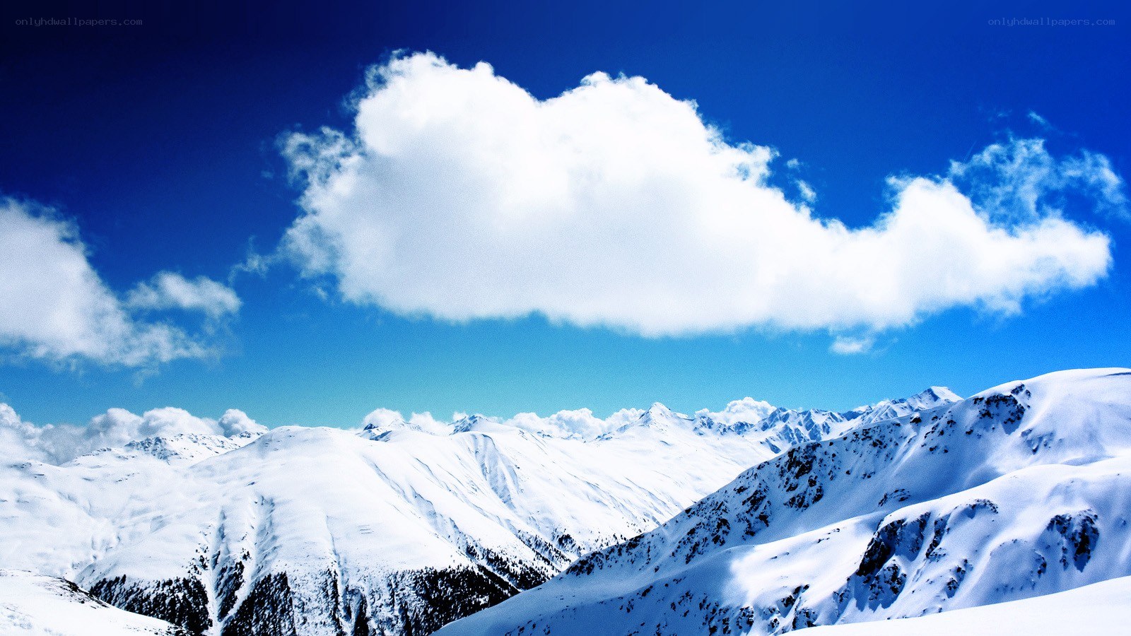Snowy mountains under blue sky