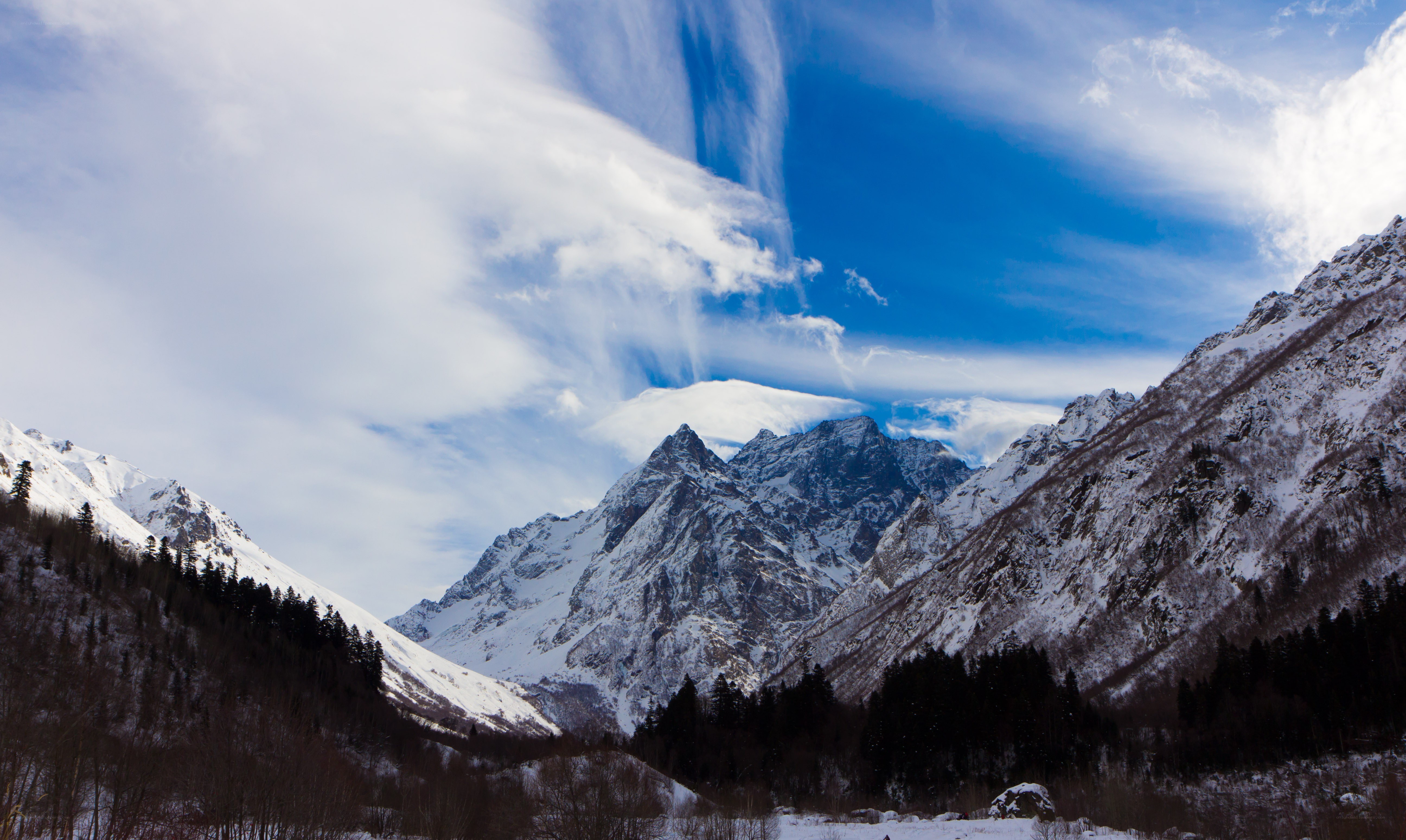 snowy mountains under blue sky