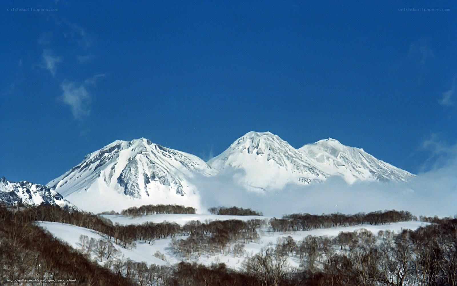Snowy mountains under blue sky