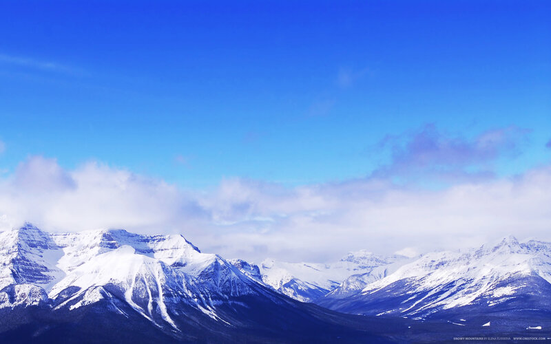 Snowy mountains under blue sky