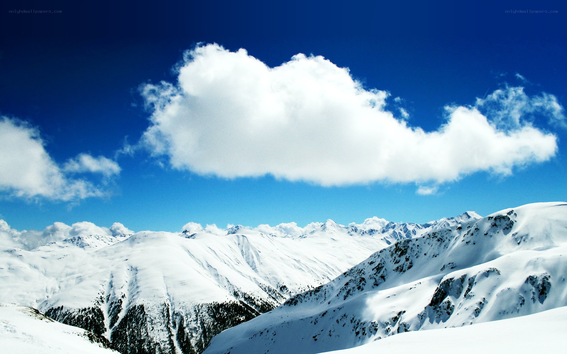 Snowy mountains under blue sky