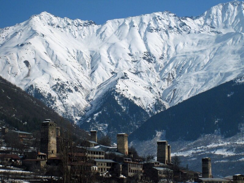 Snowy mountains with ancient towers