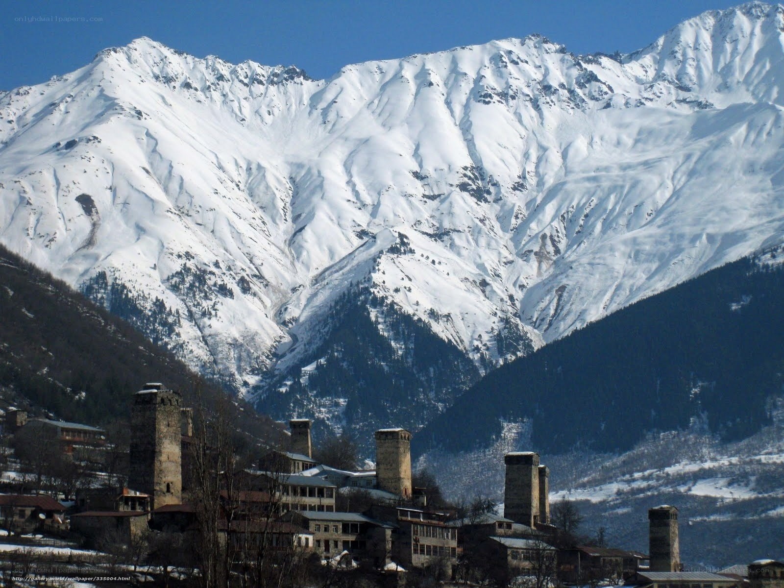 Snowy mountains with ancient towers