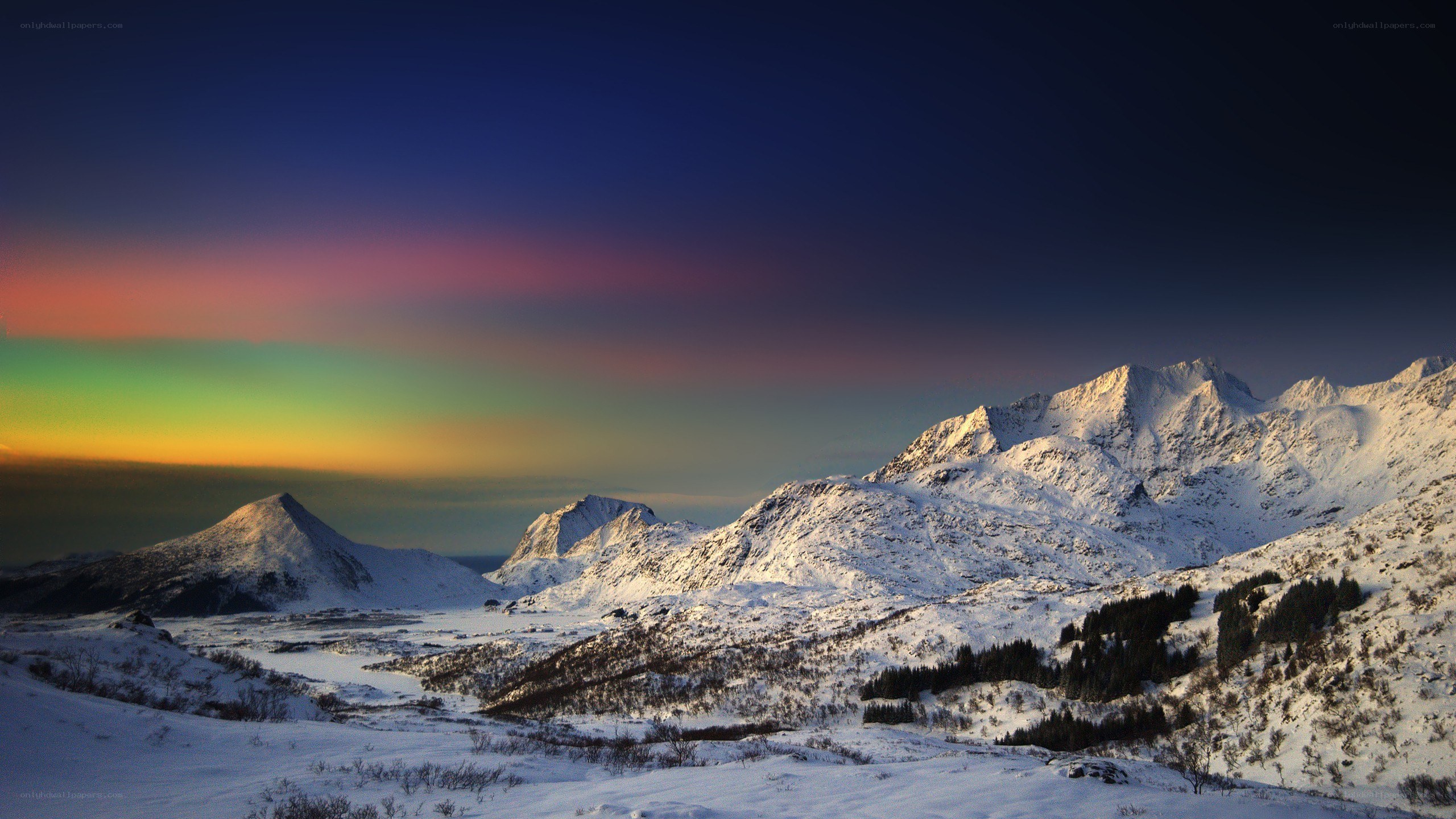 Snowy mountains with aurora