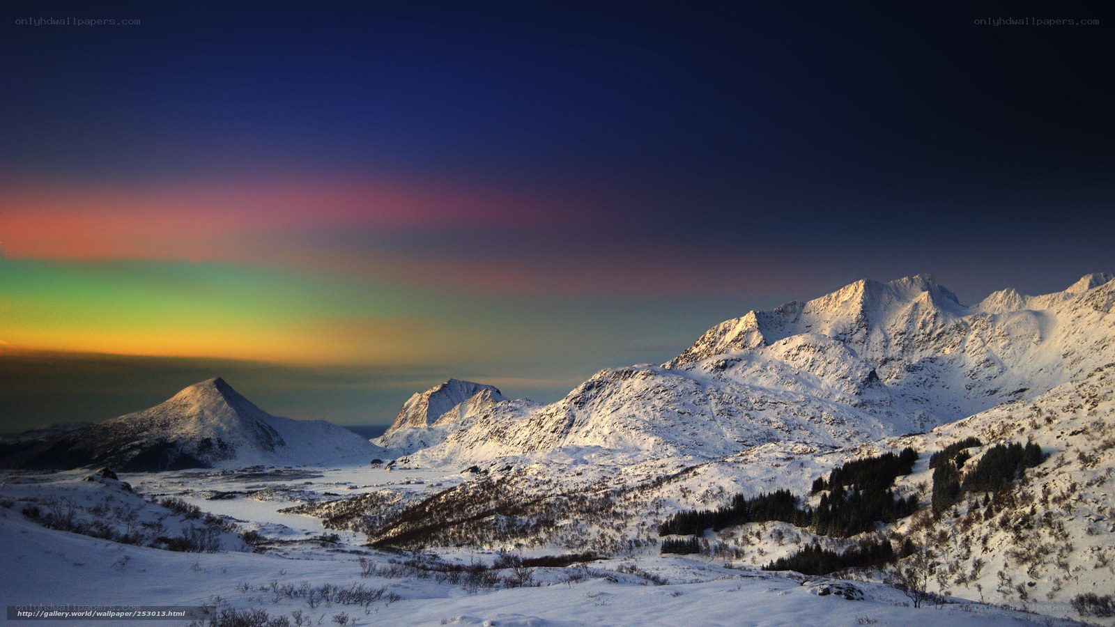 Snowy mountains with aurora