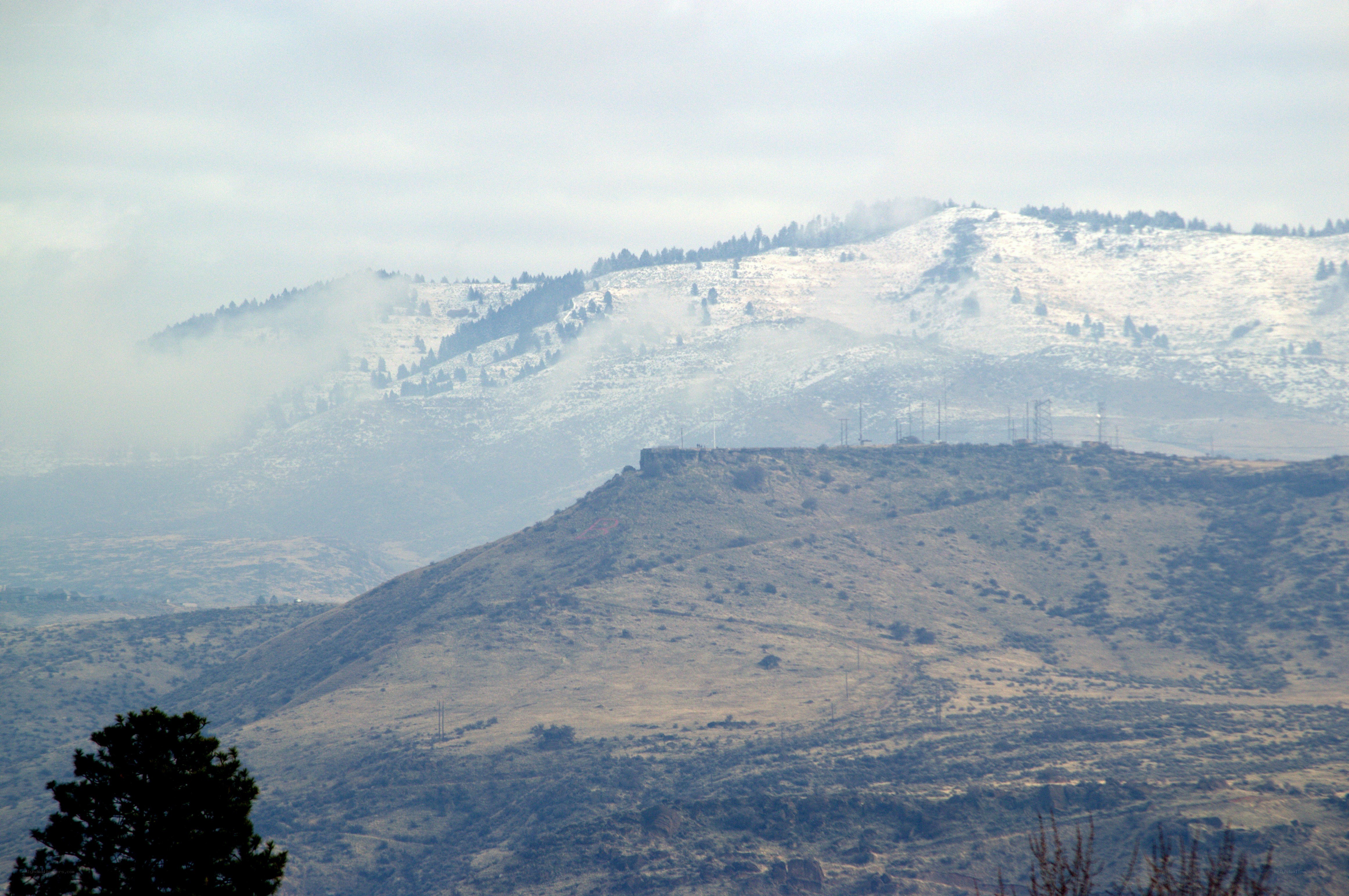 snowy mountains with power lines