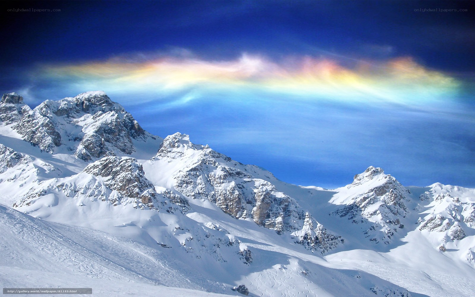 Snowy mountains with rainbow clouds