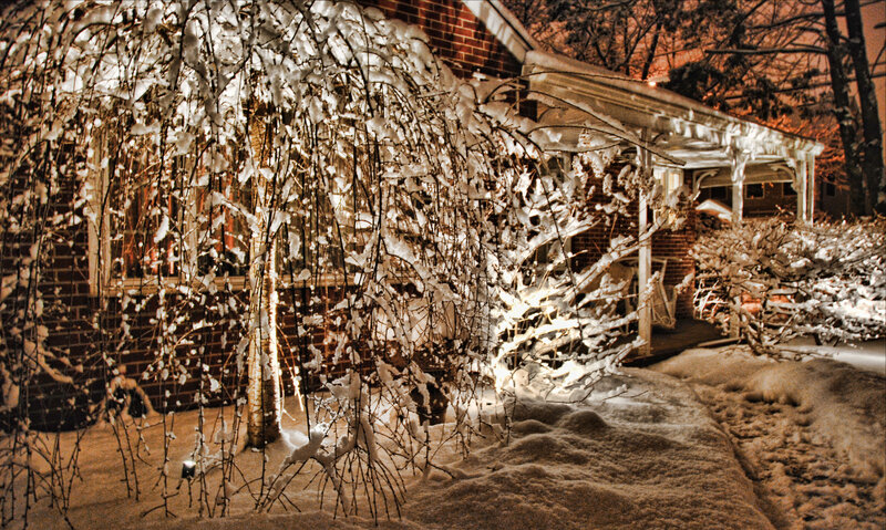 Snowy night at a brick house