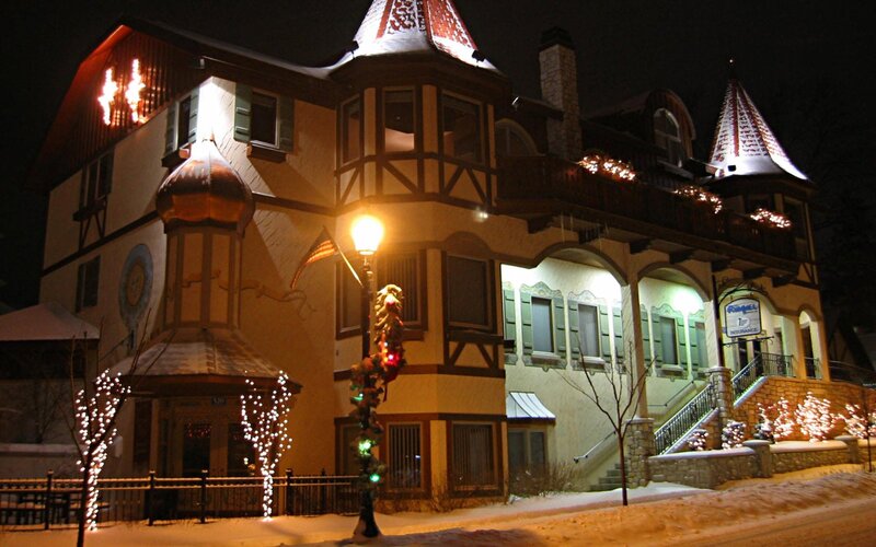 snowy night at a decorated building