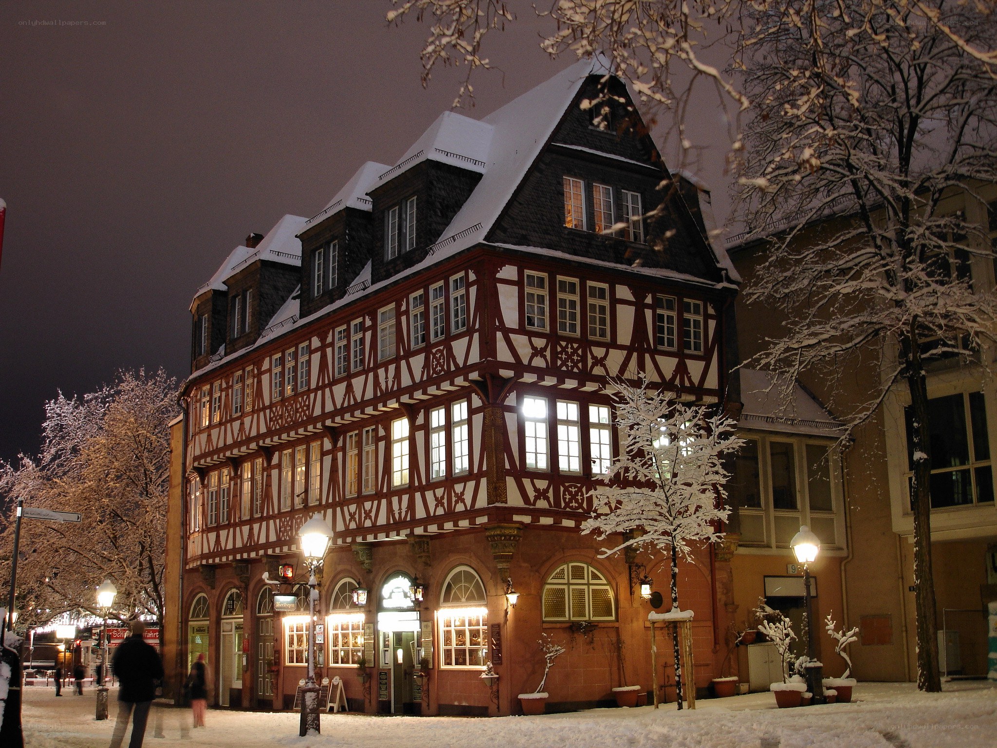 Snowy night at a half-timbered building