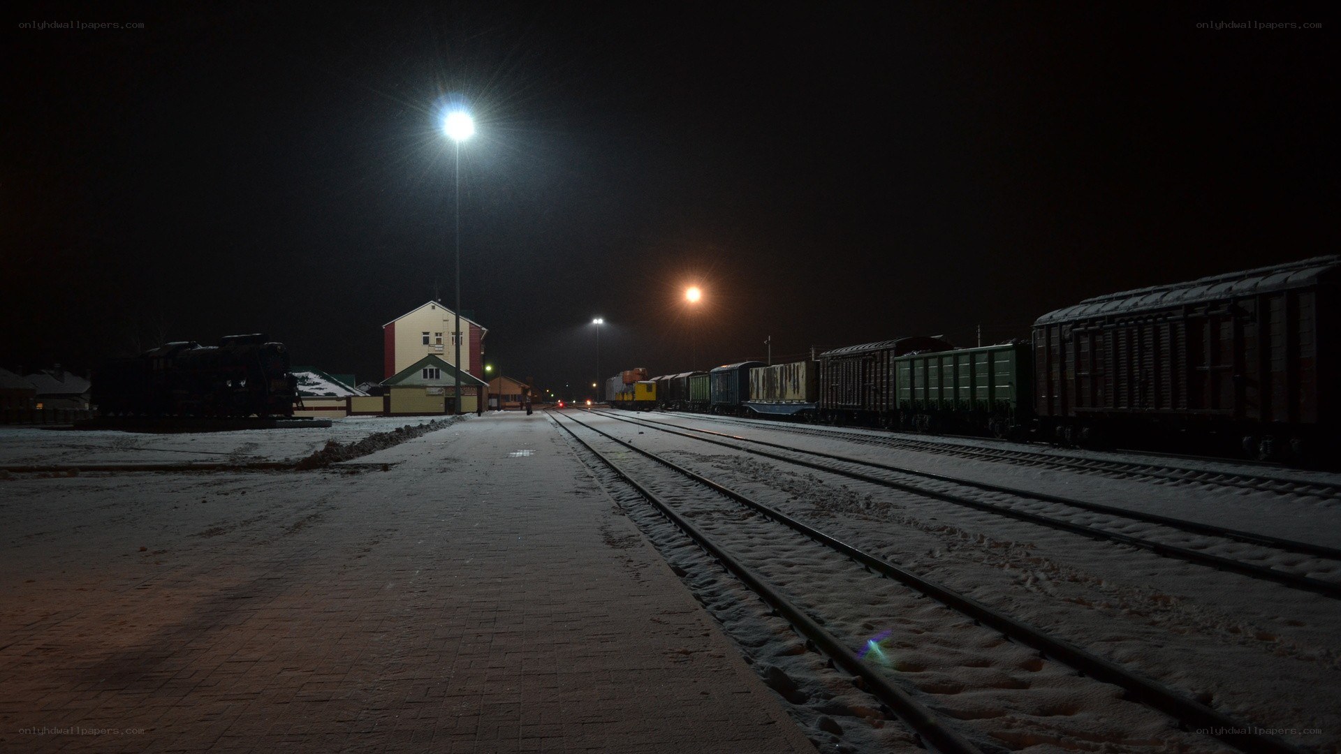 Snowy night at a train yard